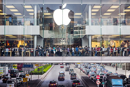 view of people inside of building with glass mirror thumbnail