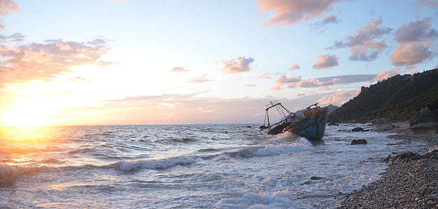 gray boat at body of water thumbnail
