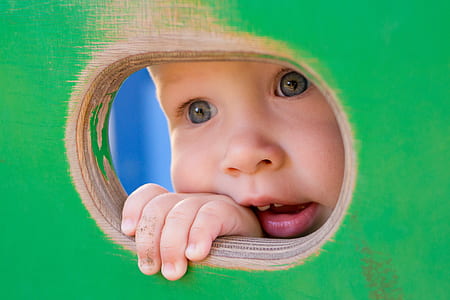toddler peeking on hole thumbnail