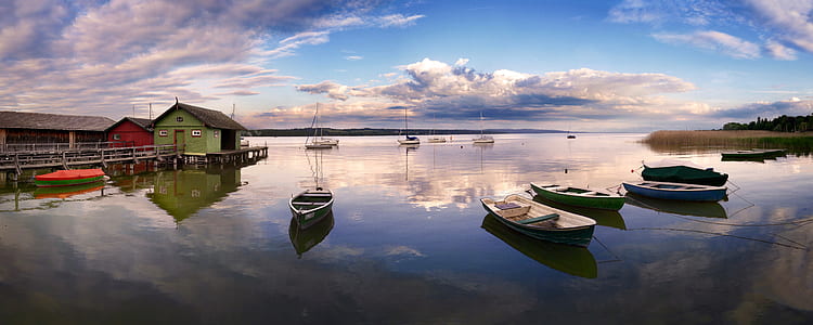 several boats on water near dock thumbnail
