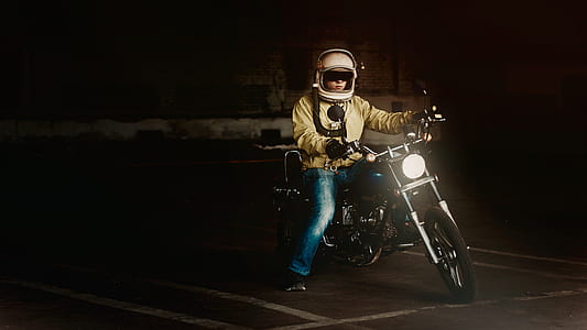 Man Wearing White Full Face Helmet Riding on Standard Motorcycle thumbnail
