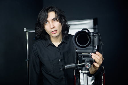 man holding video camera thumbnail