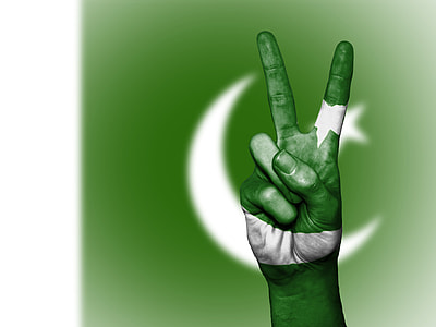 person's doing peace hand gesture on flag of Turkey background thumbnail