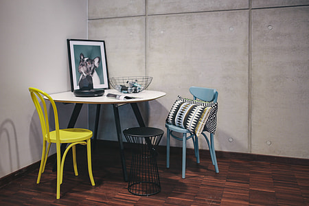 Collection of chairs and tables arranged at a design exhibition thumbnail