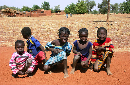 five children sitting on sand thumbnail