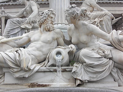 man and woman holding vase statue thumbnail