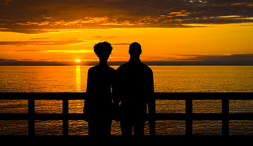 Sunset with standing couple - photo illustration thumbnail
