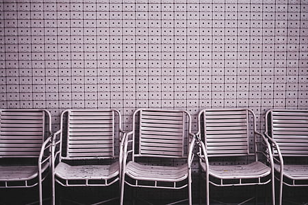 five brown metal chairs inside room thumbnail