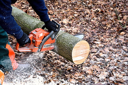 man holding chainsaw thumbnail