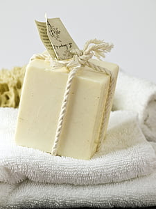 square white soap on white bathroom towel thumbnail