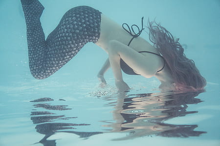 woman in black pants and bra in body of water thumbnail