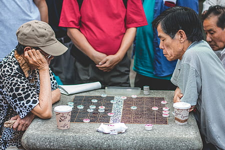 two persons playing checkers thumbnail