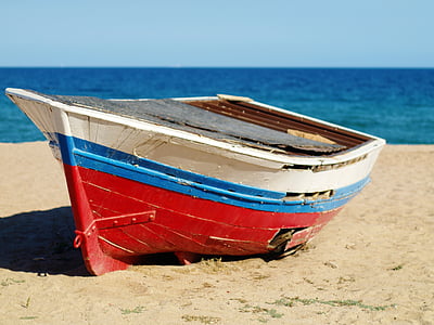 white, blue, and red jon boat in beach thumbnail