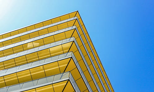 low-angle view of yellow and white building thumbnail