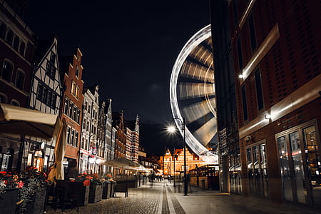 low-angle photography of light buildings and stores during nighttime thumbnail