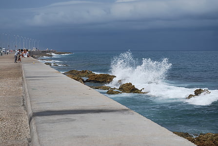 photo of people standing near sea thumbnail