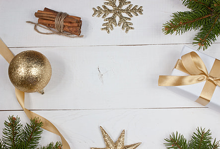 flat lay photography of gold Christmas baubles and gift box thumbnail