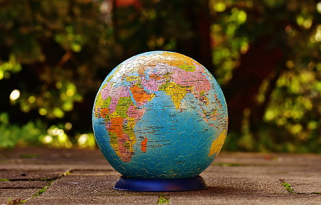 selective focus photography of multicolored desk globe thumbnail