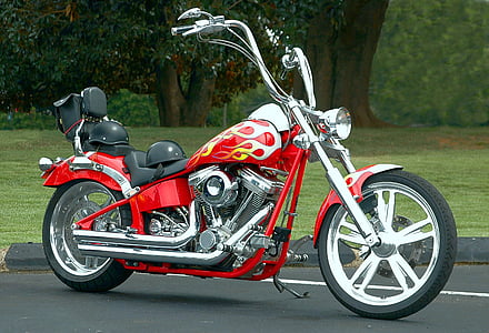 red and black chopper motorcycle on road thumbnail