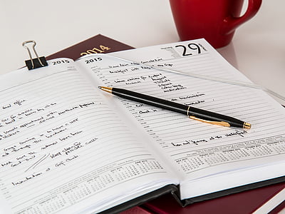 black pen on white planner thumbnail