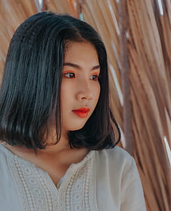 Woman Wearing White Top With Red Lipstick thumbnail