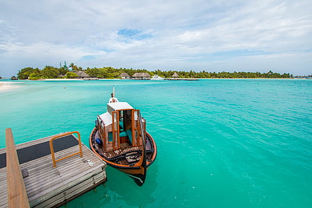 boat on green body of water thumbnail