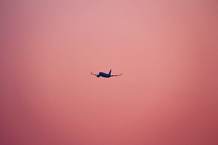silhouette of flying airplane thumbnail