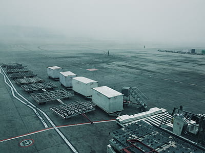 aerial view photography of four white dry van trailers thumbnail