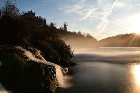 waterfalls near forest thumbnail