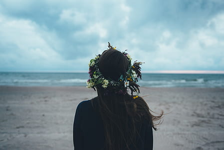 person standing on land within seashore range thumbnail