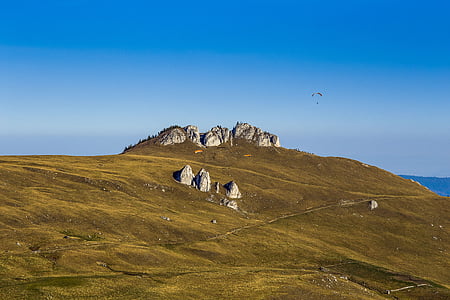 gray rock formation under blue sky at daytime thumbnail