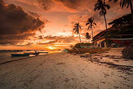 boat near body of water during sunset thumbnail