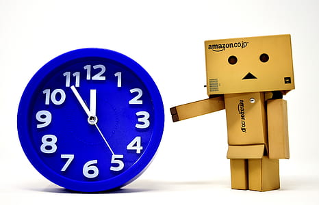Amazon Danbo standing beside analog clock time at 11:55 thumbnail