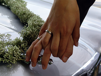 two person holding Jaguar vehicle hood ornament thumbnail