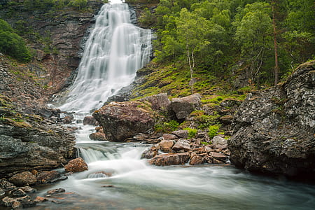 waterfalls between green trees thumbnail