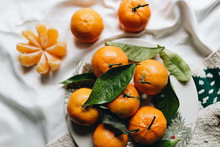 Still life of mandarin oranges with leaves thumbnail
