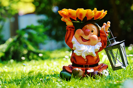 Dwarf figurine on grass field thumbnail