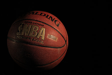 orange and black Spalding basketball thumbnail