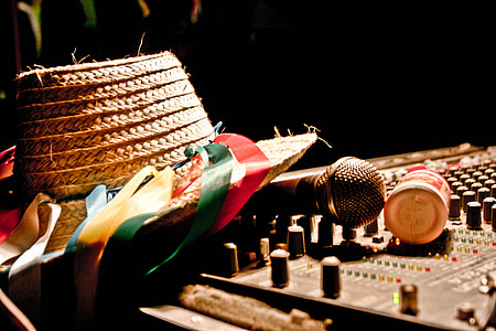 straw hat and microphone on stereo mixer thumbnail