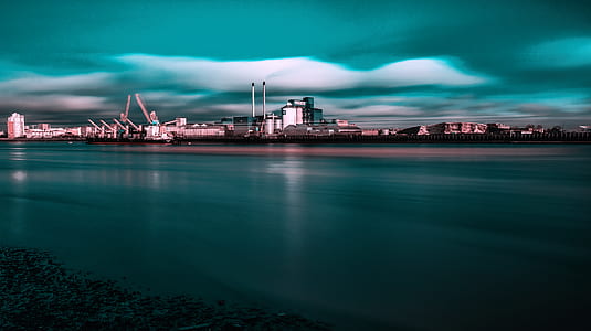 body of water near white buildings thumbnail
