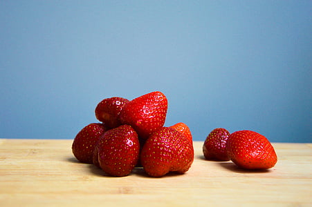red strawberry on brown wood thumbnail
