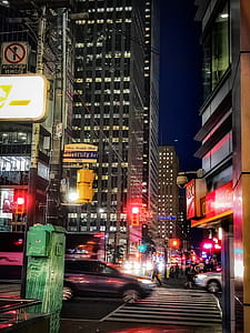 Vehicles on Street Near Tall Buildings thumbnail