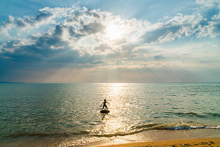 child on floating device on beach thumbnail