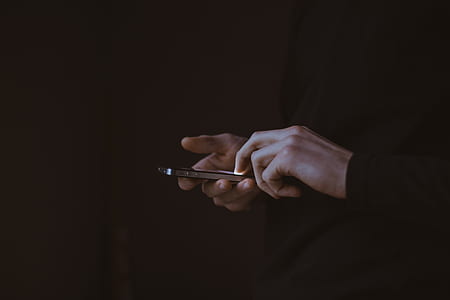 man holding iPhone thumbnail