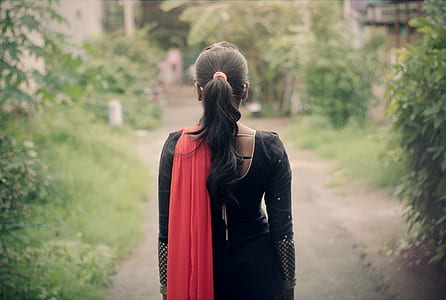 woman in black and red long-sleeved dress thumbnail