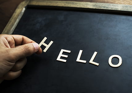 person hand holding letter H thumbnail