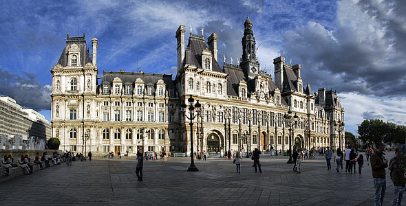 people walking near concrete palace thumbnail