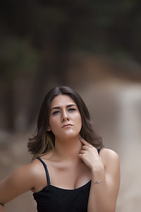 selective focus photography of woman in black spaghetti strap top thumbnail