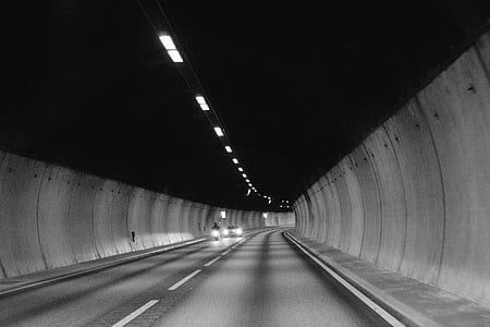 grayscale photo of road tunnel thumbnail