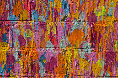Close-up shot of vibrant multi-coloured on a brick wall in East London, England thumbnail